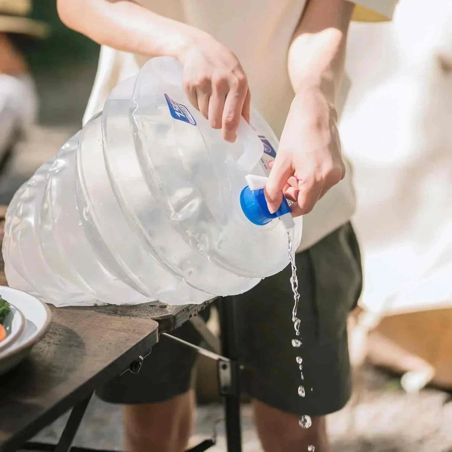 Foldable vanddunk with spout for easy pouring and minimal storage.