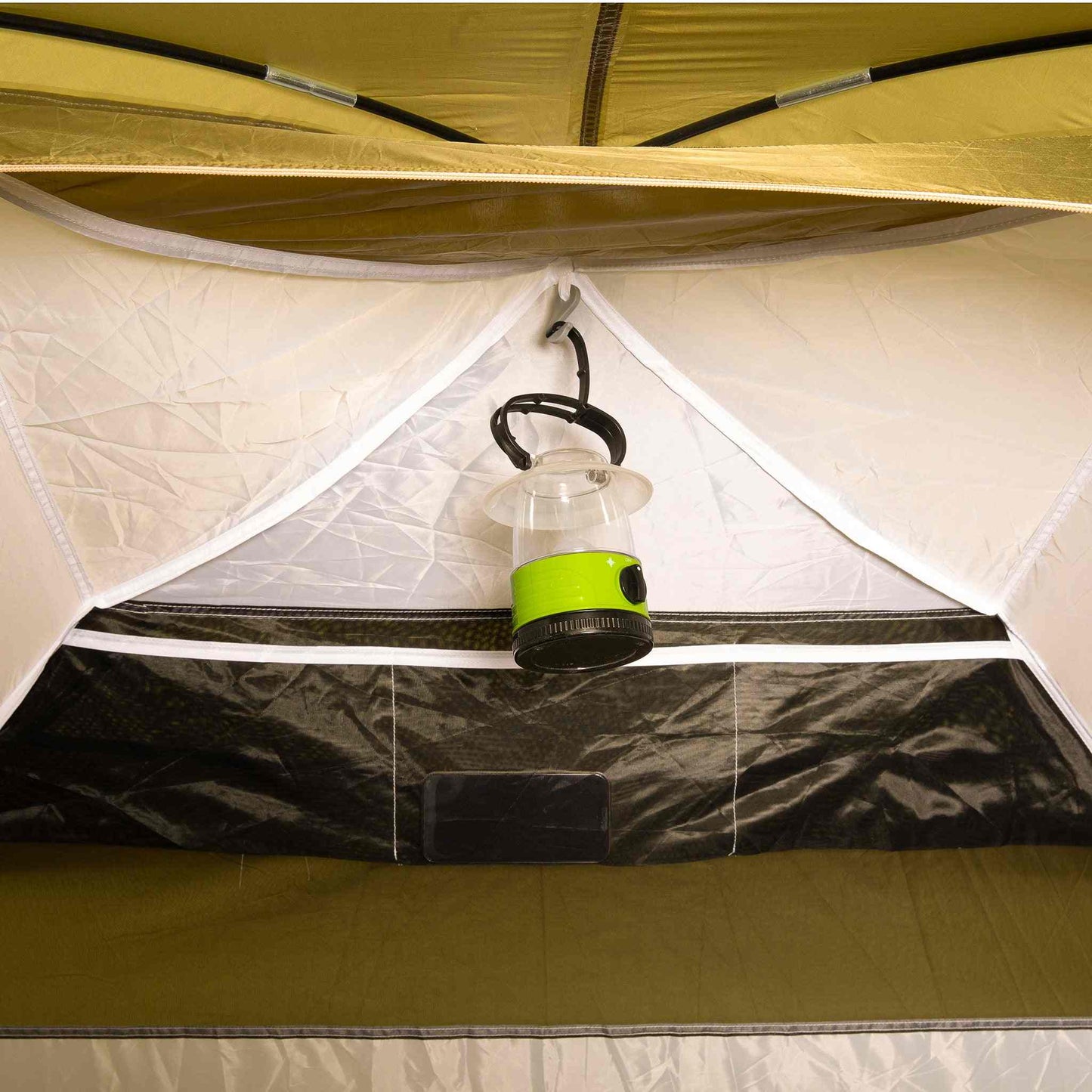 Interior view of XL 3-person festival tent with hooked lantern and ventilation.
