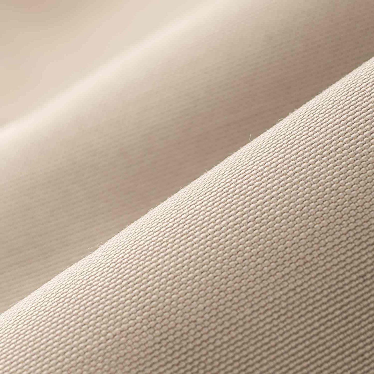 Close-up of beige toilettaske showing water-resistant material texture.