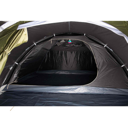 Blackout festival tent for 4 people XL interior view, showcasing roomy living space and dark sleeping area.