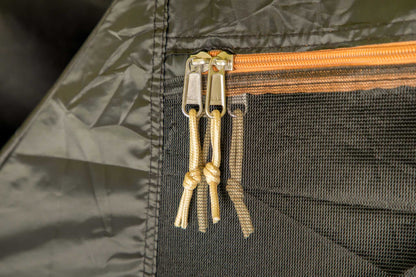 Close-up of heavy-duty SBS zippers on a blackout group tent for 4 people.